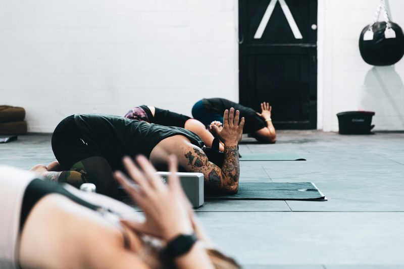 People attending a yoga class in a studio